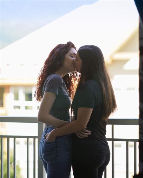 lesbian sexy|two attractive lesbian girlfriends passionately kissing and。